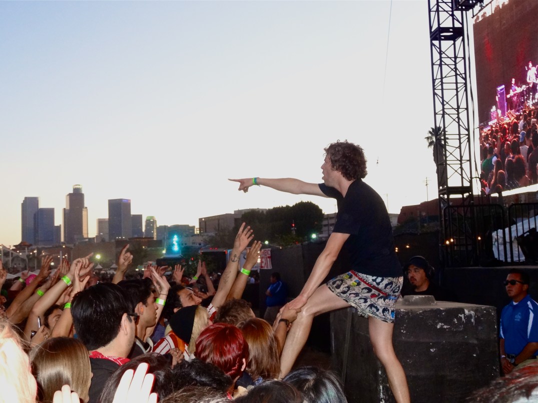 Nic Offer of !!! (ChkChkChk) getting into the audience during their set.